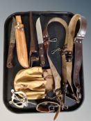 Two hunting style knives in leather sheaths, leather pouch,