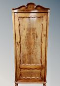 A 19th century Danish walnut sentry door cabinet with shelved interior,