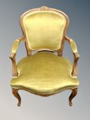 A French carved beech salon chair in olive upholstery