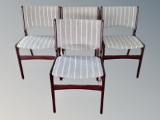 A set of four Danish stained teak dining chairs after a design by Henning Kjaernulf,