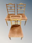 Three late Victorian walnut and satin wood inlaid salon chairs