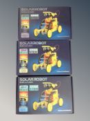 Three boxed solar powered robot kits
