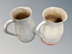 Two aluminium milk jugs,
