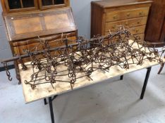 A set of cast iron grass harrows