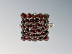 A vintage silver garnet cluster ring, size V/W.