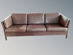 A Danish three seater brown stitched leather upholstered three seater settee, length 213 cm,