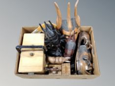 A quantity of ethnographic items, African hardwood masks, elephant figures,