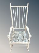 A painted spindle backed rocking chair