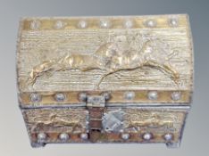 A 19th century Persian Qajar brass embossed domed table box