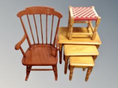 A nest of three pine tables,