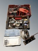 A collection of tools, chain saw, bench vice,