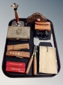 A 19th century brass bullet mould together with a teak and silver plated candlestick, gaming dice,