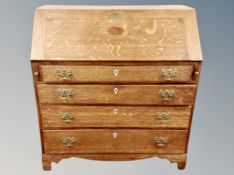 A 19th century oak fall front bureau,