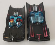 A Husky and Hotwheels Batmobiles