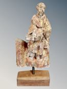 A 17th century Spanish carved and gilt wood figure of Saint Paul, on a contemporary oak stand,