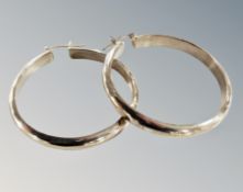 A pair of silver earrings