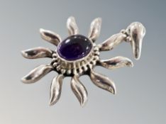 A silver amethyst pendant