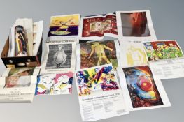 A box of un-framed art gallery and decorative prints