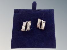 A pair of silver earrings