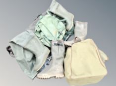 A collection of fishing equipment, landing net, folding chair,