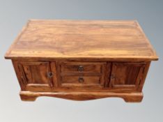 A stained pine storage coffee table,