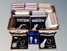 A box of International Design Quartz wrist watches with interchangeable straps and two further