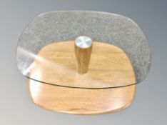 An Ercol elm and glass topped two tier coffee table,