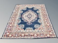 A machine made carpet of Persian design,