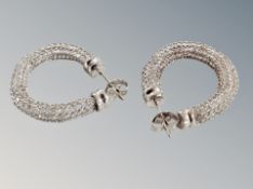 A pair of silver earrings