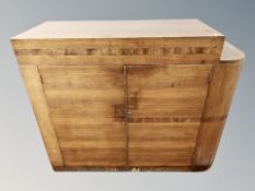 An Art Deco rosewood and figured walnut side cabinet with interior shelves and cupboards,