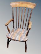A 19th century elm spindle back armchair