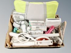 A Nintendo Wii system and assorted games, Wii fit board,
