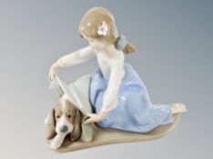 A Lladro figure 5688 Dog's Best Friend