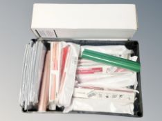 A crate and two boxes containing a large quantity of rolls of vinyl