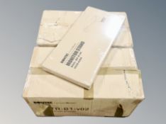 Two boxes of monitor stands