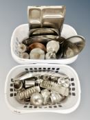 Two plastic baskets containing assorted stainless steel kitchen items, pots, dishes,