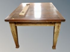 A stained pine pull-out rectangular dining table and a set of six reproduction mahogany armchairs