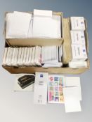 A box of padded envelopes, tablet wipes,