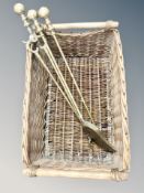 A wicker twin handled hamper and a brass fire companion set