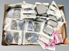 A box of air pod case covers, business card holders,