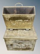 A brass magazine rack and coal bin