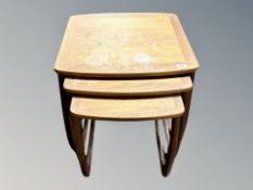 A teak nest of tables, width 53 cm, plus another similar.