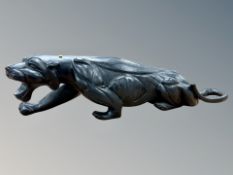 A carved hardwood panther figure,