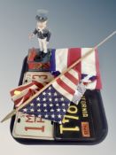 Two American style tin registration plates together with an American flagpole,