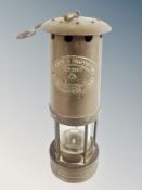 An E Thomas and Williams brass miner's lamp