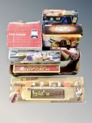 A box of games including tin can shooting gallery,