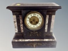 A late Victorian marble and black slate eight day mantel clock,