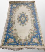 A Chinese rug on beige ground 230 cm x 117 cm