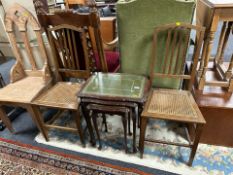 A reproduction carved nest of tables and a pair of Edwardian oak armchairs