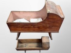 A 19th century pine crib together with a further doll's crib
